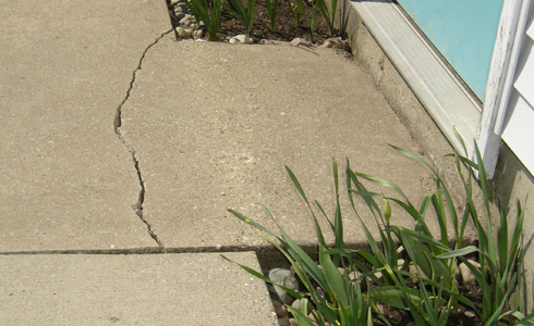 No gutters leads to sidewalk cracking.