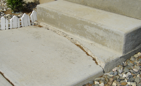 Exccess rain water causes damage to concrete steps.