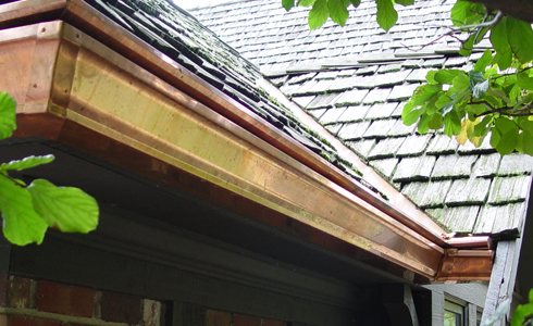 Copper gutter from All Gutter Systems looks great with shake and slate shingles.