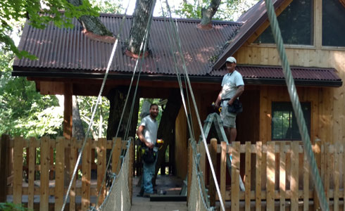 Custom gutter installation on a tree house in Michiagn